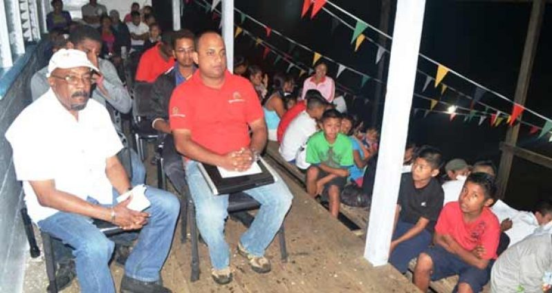 Minister of Local Government and Regional Development, Norman Whittaker and Regional Executive Officer, Ronald Harsawack at the flag raising ceremony at Kopinang, Region 8, on the eve of Guyana’s 44th Republic Anniversary