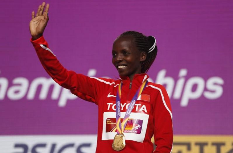 Rose Chelimo of Bahrain  poses with gold medal.