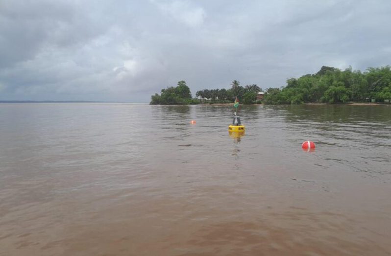 Deployment of Data Buoys on the Essequibo River, in the vicinity of Saxacalli Village (Photo courtesy of the EPA)