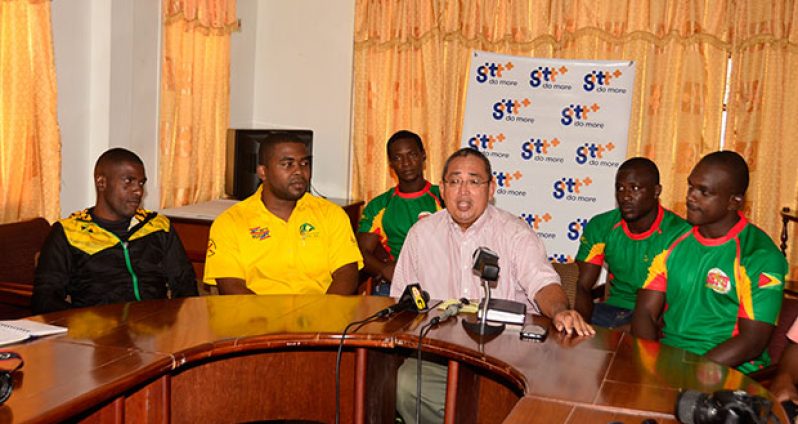 (L-R) Jamaica skipper Hubert Thomas, technical director Tezra Sannister, GRFU president Peter Green, Guyana captain Richard Staglon. Pebo Hamilton, Avery Corbin (background)