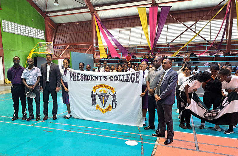 Officials pose with students of President’s Coolege at yesterday’s launch