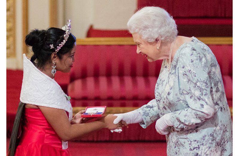 Samantha Sheoprashad receiving her Queen’s Young Leaders Award in 2017 from the Queen of England (Photos courtesy of Samantha Sheoprashad)