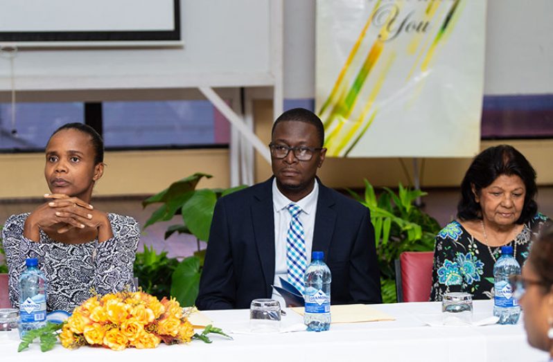 From left- Researcher and Journalist, Samantha Alleyne-Williams, Chairman of ChildLink, Kosi John and another official