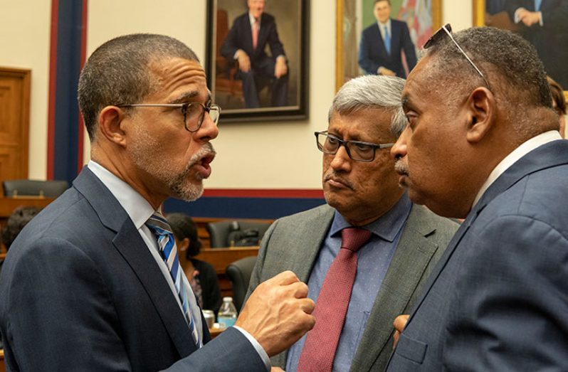 Congressman Anthony Brown (left) in conversation with DDL Chairman, Komal Samaroo and Wesley Kirton