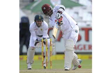 Marlon  Samuels uses his feet once too often against  off-spinner Simon Harmer and holes out to long-on when well set on 74.