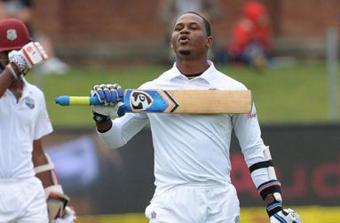 Marlon Samuels celebrates reaching his sixth Test hundred against South Africa