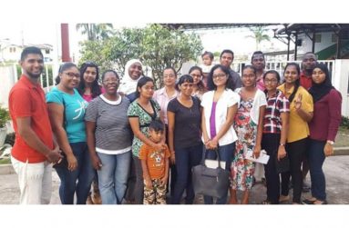 Sandra poses with women she empowers through her foundation