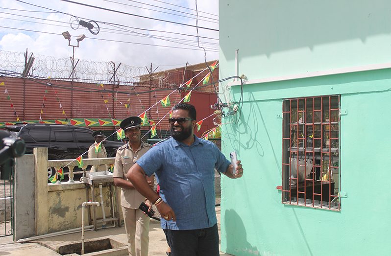GECOM Commissioner, Sase Gunraj makes his way into the GPS Sports Club to observe the voting process shortly after greeting Director of Prisons, Nicklon Elliot (Japheth Yohan Savory photo)