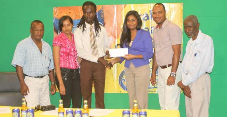 In this Sonell Nelson photo, BCB’s third vice-president Julian Cambridge (third left) accepts the sponsorship cheque from Ansa McAl’s Public Relations Officer, Darshanie Yussuf, while looking on from extreme left are: BCB’s selector Ravindranauth Saywack and Office Administrator Alisa Moonsee, Ansa McAl’s Brands Coordinator Nigel Worrell and BCB’s Life Member Malcolm Peters.