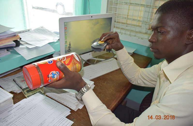 A staff member at the FWCH utilises a bar code scanner, part of the electronic store inventory management system introduced last year
