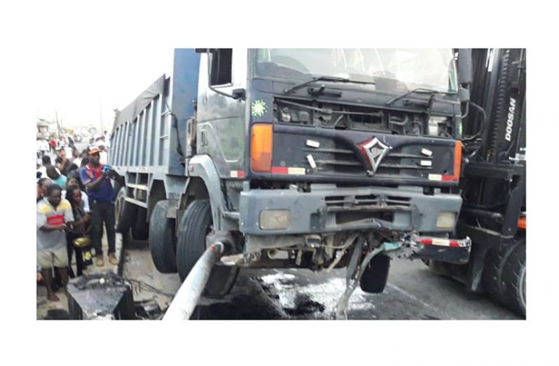 The truck being removed from the scene.