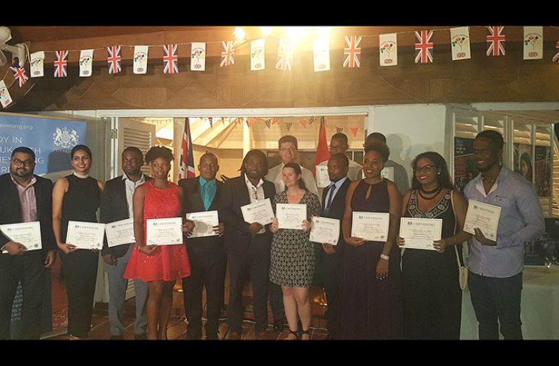 The Chevening Scholarship awardees and Bristish High Commissioner to Guyana, Greg Quinn during last  Thursday night’s reception at the envoy’s Bel Air residence