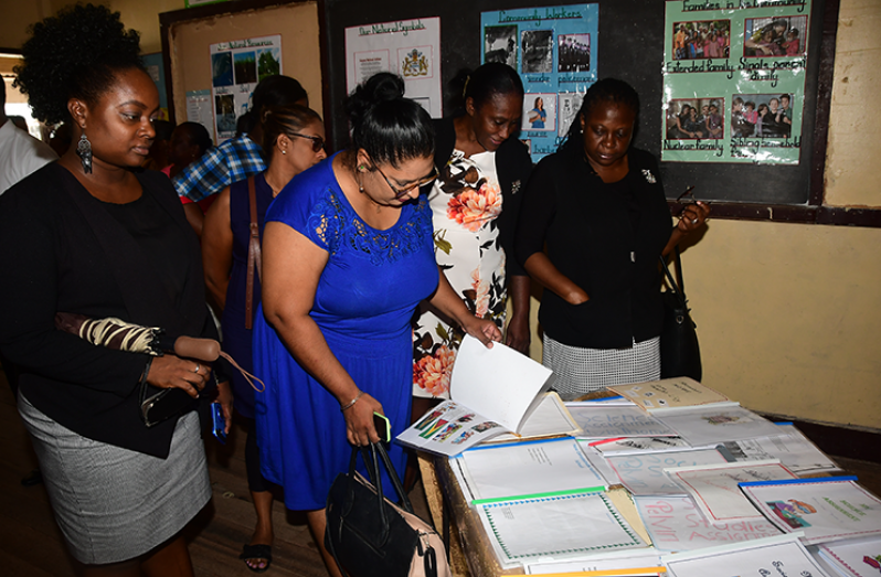 Principal Education Officer, Ms. Volika Jaikishun, along with several other teachers and the Transition Exhibition on Monday