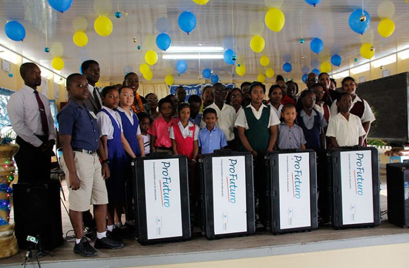 Minister Henry and Ambassador Dormeus along with head teachers and students of the 14 schools pose for a photograph with the Profuturo Kits
