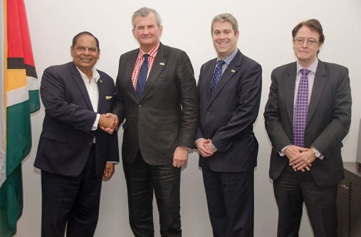 Prime Minister, Moses Nagamootoo greets UK Security expert, Russell Combe in the presence
of Deputy UK High Commissioner to Guyana, Ron Rimmer (right) and another official during
a meeting at the Office of the Prime Minister on Monday (Adrian Persaud photo)