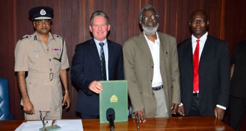 Police Commissioner (ag), Seelall Persaud, British High Commissioner, Andrew Ayre, Head of the Presidential Secretariat, Dr. Roger Luncheon and Head of SOCU, Lt. Col Sydney James after the signing of the MOU for the training and mentoring of staff attached to the Special Organised Crime Unit