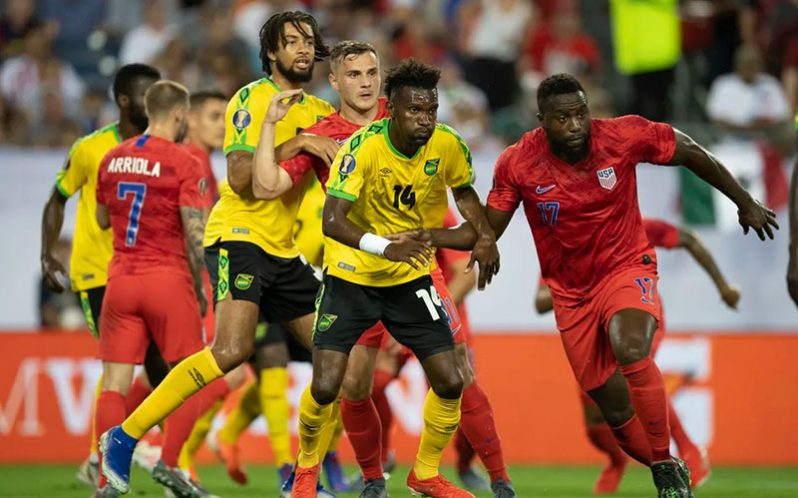 United States Jozy Altidore and Jamaica’s Shaun Francis battle for possession of the ball in the CONCACAF Gold Cup semifinal match on Wednesday night at Nissan Stadium in Nashville, Tennessee.