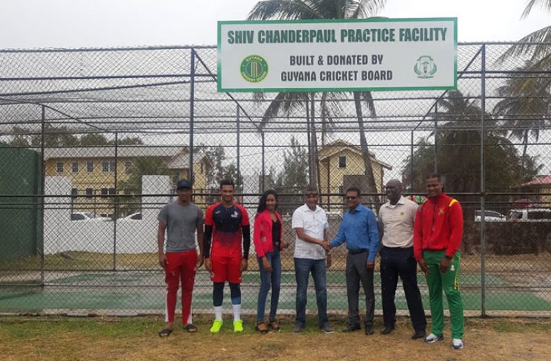 GCB’s Anand Sanasie (left) and ECC’s Manzoor Nadir (right) shake hands to observe the opening of the Shiv Chanderpaul Practice Facility in the presence of Ms Spencer, national players Gudakesh Motie, Akshaya Persaud and Clinton Pestano and Colin Stuart