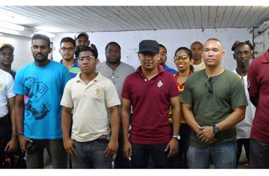 The top three shooters in both senior and junior categories (in front row) with other competitors at the TSU Range at Eve Leary.