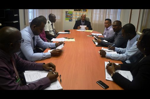 Minister Holder and other officials during the meeting with the high-level officials