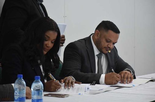 Minister of Natural Resources Vickram Bharrat (right) and CEO of Cybele ENergy Limited, Beatrice Mensah Tayui during the signing of the agreement (Sachin Persaud photos)