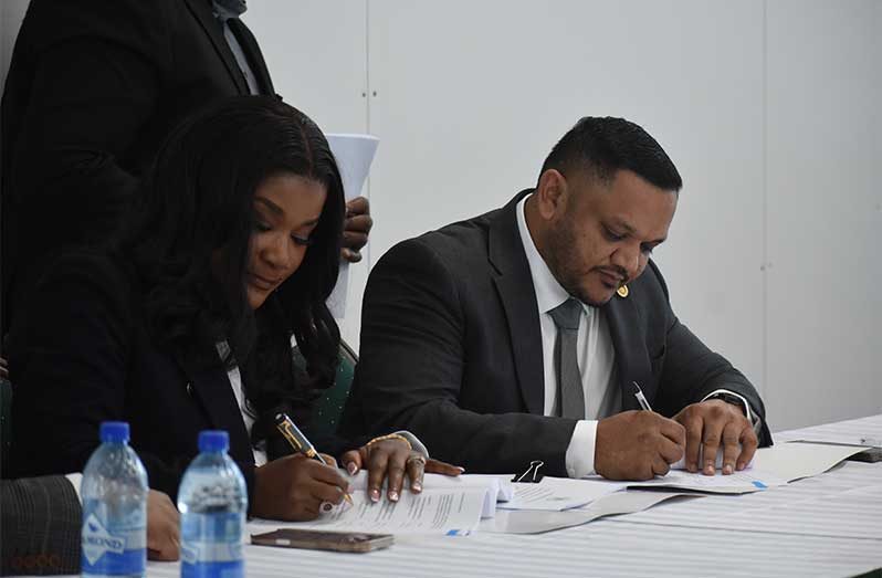 Minister of Natural Resources Vickram Bharrat (right) and CEO of Cybele ENergy Limited, Beatrice Mensah Tayui during the signing of the agreement (Sachin Persaud photos)