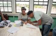 A small contractor from Ituni, Region Ten signing a road contract on Friday