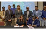 CEO of Global Ventures Consultancy Inc, Emily King and Permanent Secretary of the Ministry, Joslyn McKenzie sign the MoU 𝐟𝐨𝐫 𝐭𝐡𝐞 𝐂𝐨𝐧𝐬𝐮𝐥𝐭𝐢𝐧𝐠 𝐒𝐞𝐫𝐯𝐢𝐜𝐞𝐬 𝐟𝐨𝐫 𝐌𝐢𝐧𝐞𝐫𝐚𝐥 𝐌𝐚𝐩𝐩𝐢𝐧𝐠 𝐒𝐭𝐮𝐝𝐲 𝐨𝐟 𝐆𝐮𝐲𝐚𝐧𝐚’𝐬 𝐌𝐢𝐧𝐞𝐫𝐚𝐥 𝐑𝐞𝐬𝐨𝐮𝐫𝐜𝐞𝐬 (𝐠𝐨𝐥𝐝 𝐫𝐞𝐬𝐨𝐮𝐫𝐜𝐞𝐬 𝐚𝐧𝐝 𝐧𝐨𝐧-𝐭𝐫𝐚𝐝𝐢𝐭𝐢𝐨𝐧𝐚𝐥 𝐦𝐢𝐧𝐞𝐫𝐚𝐥𝐬), while flanked by Minister of Natural Resources, Vickram Bharrat; United States Ambassador to Guyana, Nicole Theriot, Guyana Geology and Mines officials and other representatives (Japheth Savory photo)