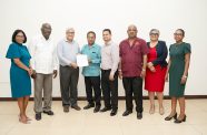 At the signing are, from left, Outgoing HR Director Moneeta Singh-Bird; GLU General Secretary Mr. Carvil Duncan; DDL Chairman Mr. Komal Samaroo; GAWU President Mr. Seepaul Narine and other officials