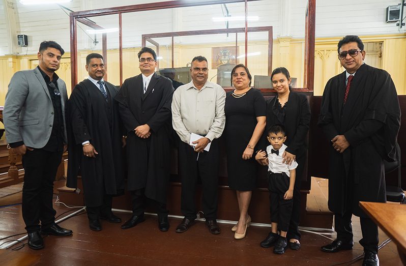 Newly-appointed attorney-at-law, Teakaram Singh, third left, and family members in the company of Justice Navindra Singh, and Attorney-General Anil Nandlall