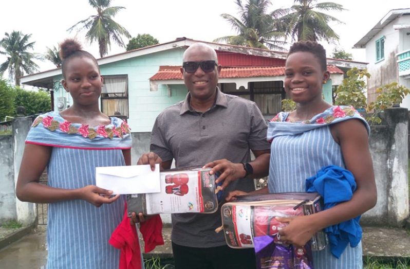 (In photograph above, Ninvalle presents the rewards to the new pride of West Ruimveldt, Abiola (left), and 14-year-old Alisha.