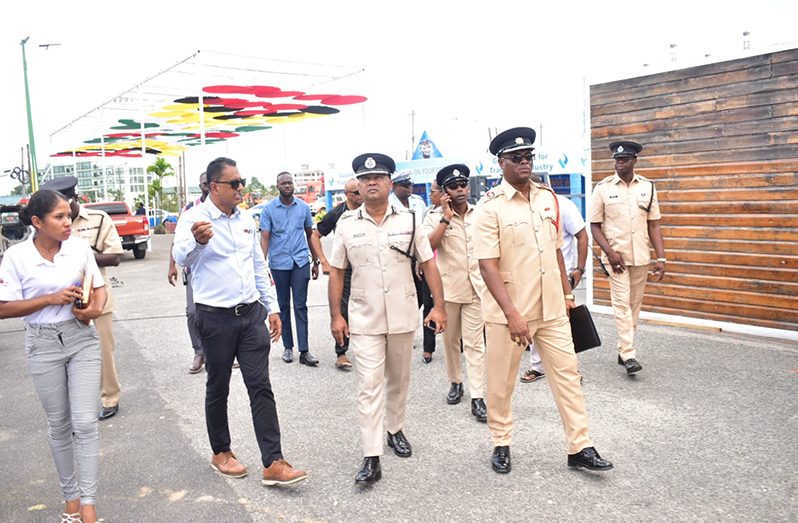 Deputy Commissioner Ravindradat Budhram (centre) flanked by Impressions proprietor, Patrick Sukhlal and senior Fire and Police ranks at the site visit at the Guyana National Stadium, in preparation for the International Building Expo