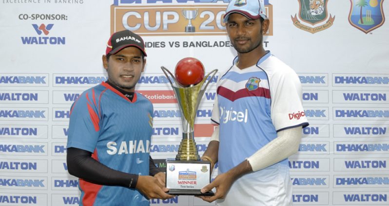 Captains Mushfiqur Rahim (left) and Denesh Ramdin pose with the series trophy, yesterday