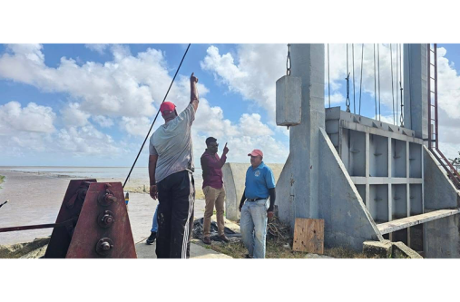 Region Two’s officials inspect the sluice at Andrews Pump Station during a recent visit
