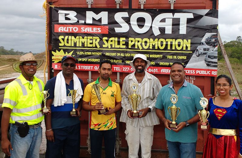 In photo, Ryan McKinnon (centre right) and Jagmohan Bassoo (center left) pose with other prize
Winners’.