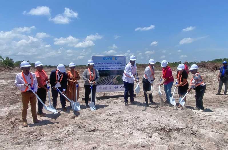 PM Phillips, Region Two Regional Chairperson Vilma De Silva, Regional Vice-Chairman Humace Oodit, Regional Executive Officer Susannah Saywack, Prime Minister representative Arnold Adams, Guyana Power and Light Executive Management Committee Head, Kesh Nandlall and NDC Chairpersons Hansoutie Ramkellwan and Chandrawattie Coomal turning the sod at the Onderneeming site where a solar farm will be installed