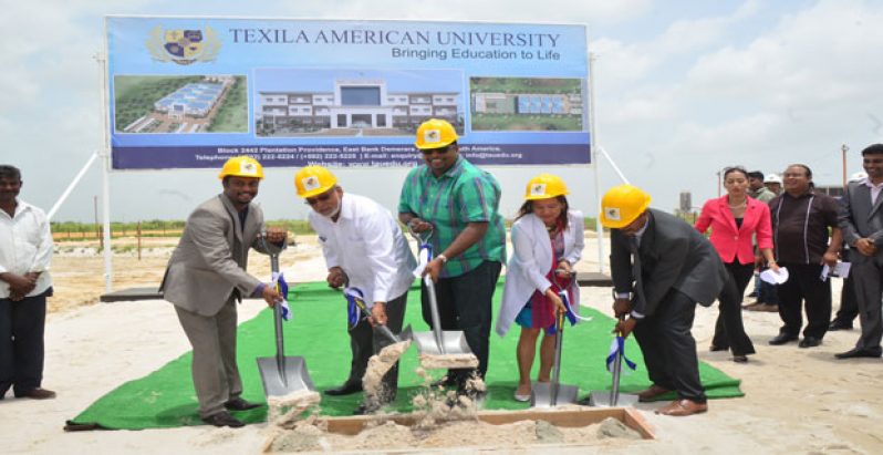 Texila American University founder Saju Bhaskar, President Donald Ramotar and Housing Minister Irfaan Ali join other university officials in turning the sod for the construction of the US$20 million university campus at Providence, East Bank Demerara.