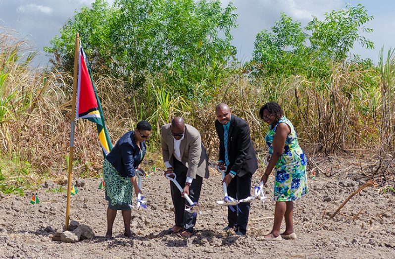 The sod-turning for the Windsor Estates East Coast. From left are: Minister of Public Health, Volda Lawrence; Head of NICIL, Colvin Heath-London; Navigant Project Manager, Mark Thomas; and Demerara Mahaica Regional Chairman, Genevieve Allen (Delano Williams photo)
