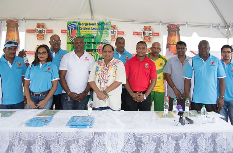 Prime Minister and First Vice President, Moses Nagamootoo, flanked by Minister of Public Security, Khemraj Ramjattan, executive members of the Georgetown Softball Cricket League Inc. and representatives of the three major sponsors during yesterday’s official launching. (Samuel Maughn Photo)