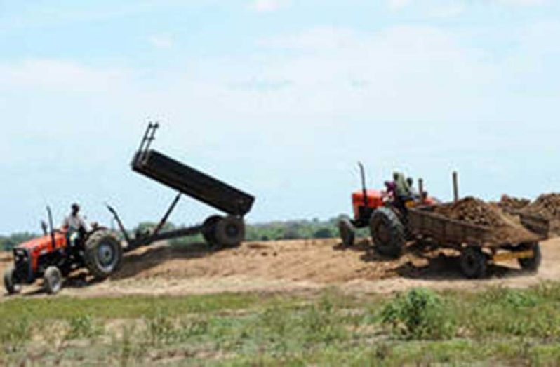 Farmers unload soil in Sri Lanka