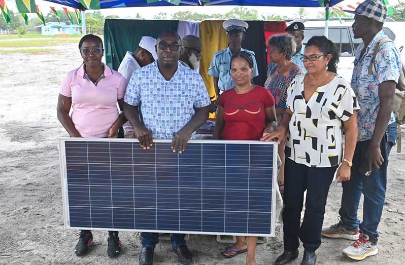 Minister within the Office of the Prime Minister with Responsibility for Public Affairs, Kwame McCoy, fulfilling another commitment made by President, Dr Irfaan Ali, delivered solar photovoltaic home systems to residents of Silver Hill, Soesdyke-Linden Highway (Photos: Minister McCoy/Facebook)