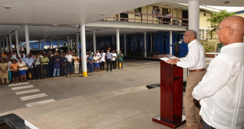 President David Granger addressing Banks DIH staff at Thirst Park, Georgetown. At right of the President is Chairman of the Board of Directors and Company Managing Director Clifford Reis