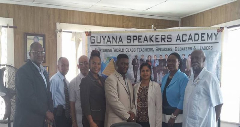 Gary Thompson (centre) with team members of the Guyana Speakers and Leadership Academy
