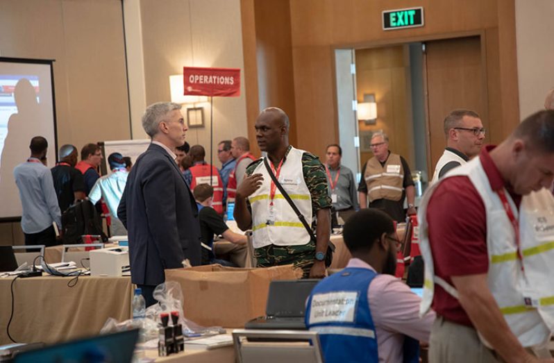 ExxonMobil Country Manager, Rod Henson and CDC Director General Lt Col. Kester Craig in discussion