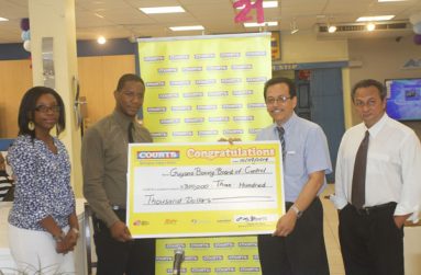 In this Sonell Nelson photo, GBBC’s secretary Howard Cox (second left) accepts the sponsorship from COURTS Marketing Manager Cornell Cummings (second right), while looking on are COURTS Public Relations and Promotion Officer Roberta Ferguson (extreme left) and GBBC’s president Peter Abdool.