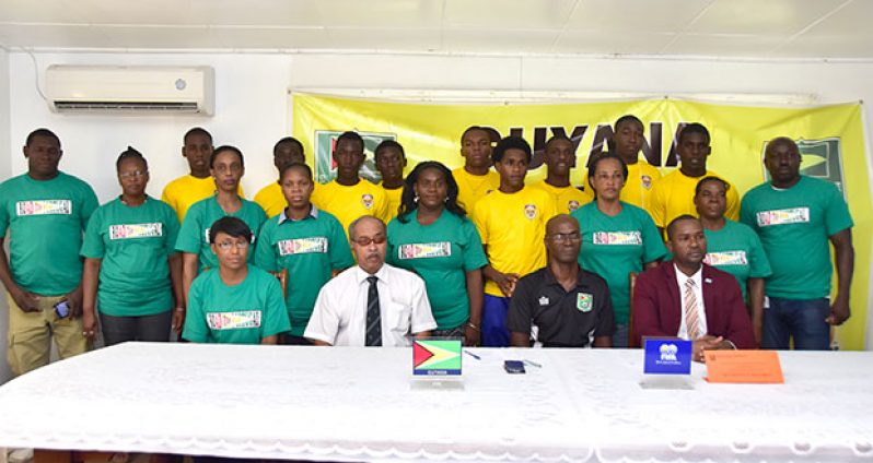 GFF president Wayne Forde seated far right is surrounded by players and parents of the Flour Power National U-17 football team at yesterday's launch of the 'Road to Portugal'. (Adrian Narine photo)