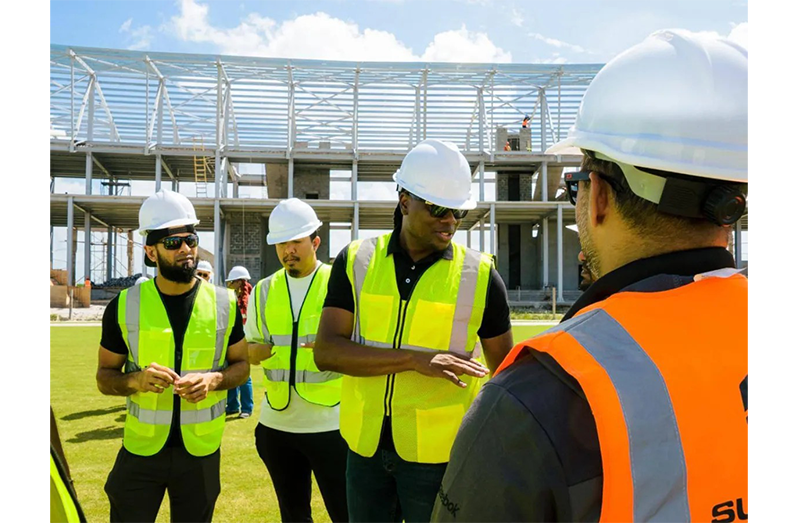 Minister within the Ministry of Culture, Youth and Sport, Seven Jacobs, engages contractors at the Palmyra Multipurpose Stadium