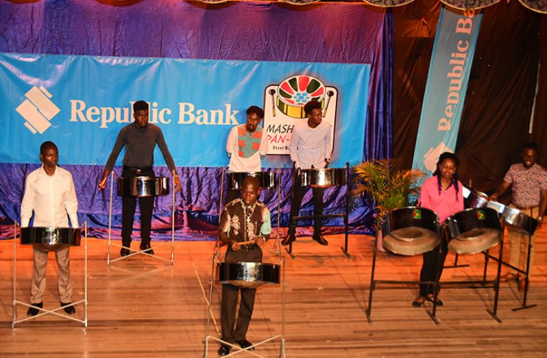 The senior steelpan soloists pose for a quick photo on stage before their clash on Thursday night (Adrian Narine photo)