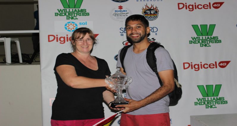 Stephen Vieira collects his Champion Rider trophy from a BPMSI representative. (Photo by S.E.A.G. Productions)