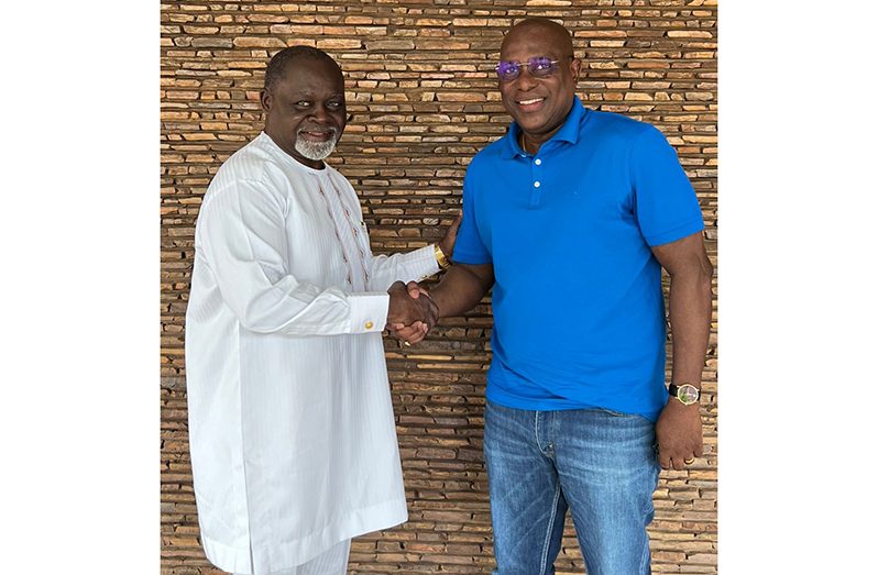 Ninvalle (right) greeted by Nelson on arrival at the residence
